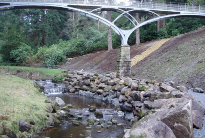 Rock river wall under bridge